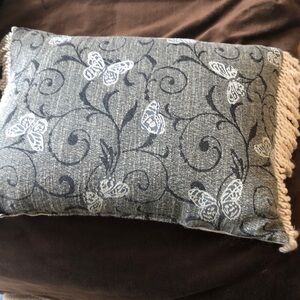 Gray pillow with butterfly